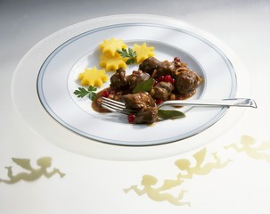 Hare with redcurrant & red wine sauce and polenta stars
