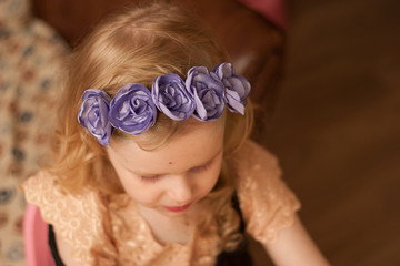 little girl with flowers on her head