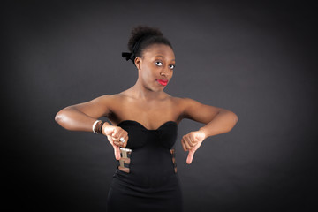 Naklejka premium Beautiful woman doing different expressions in different sets of clothes: thumbs down