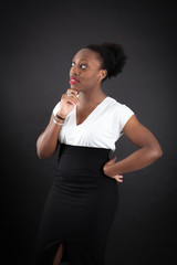 Fototapeta premium Beautiful woman doing different expressions in different sets of clothes: thinking