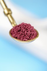 Acai powder on spoon