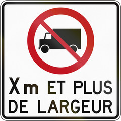 Canadian regulatory traffic sign - No lorries. The text means: X meters and more width. This sign is used in Quebec