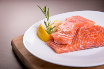 Fresh salmon fillet with rosemary and lemon.