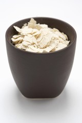 Oat flakes in brown pot