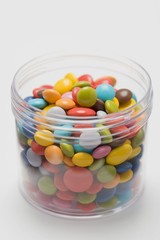 Coloured chocolate beans in jar