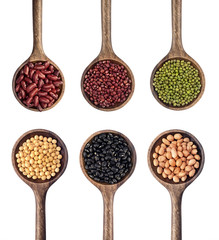 collection of beans in the wooden spoon
