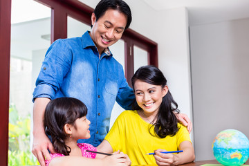 Chinese family learning mathematics with her child