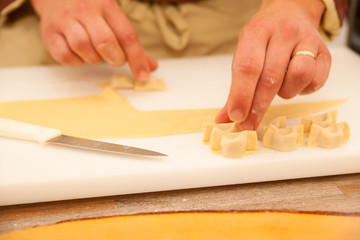 Obraz na płótnie Canvas Cheef making zlikrofi pasta lokal speciality in Idrija Slovenia