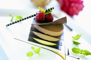 Crème brûlée layered with dark chocolate, mango sauce