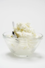Quark in glass dish with spoon