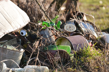 Large heap of household garbage, glass, paper, plastic and metal