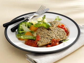 Meatloaf with vegetables and tomato sauce