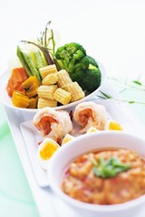 Assorted appetisers: prawns, vegetables, eggs and chilli dip