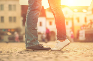 Couples foots stay at the street under sunlight