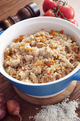 Rice cooked with vegetables and spices in ceramic form