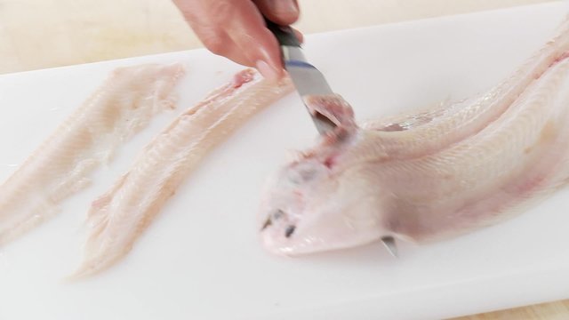 Sole being filleted