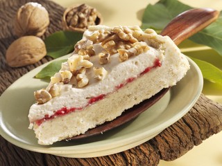 Piece of walnut cake on cake server