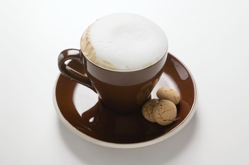 Cup of cappuccino and amaretti