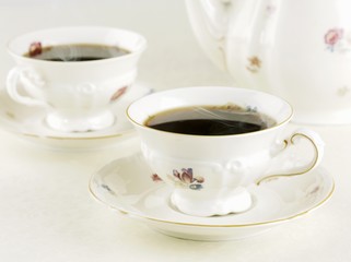 Two cups of black coffee