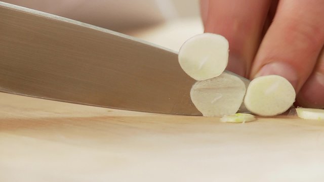 Chopping a garlic clove