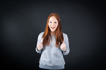 Beautiful woman doing different expressions in different sets of clothes: arms raised