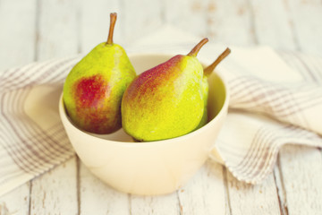 Three pears in a bowl
