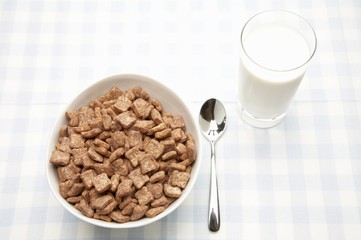 Breakfast cereal and a glass of milk