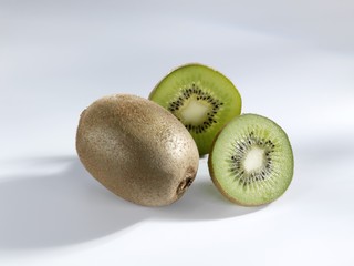 Kiwi fruit, whole and halved