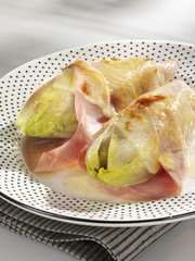 Baked chicory with ham and cheese