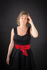 Beautiful woman doing different expressions in different sets of clothes: headache