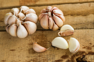 Garlic on the wooden background, Close up garlic on wooden table, Raw garlic in kitchen rooms.