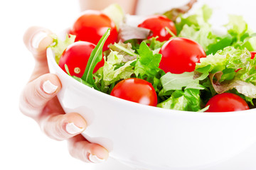Salad bowl in woman hands