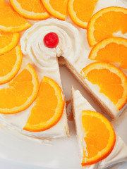 Fototapeta na wymiar Vanilla cake with orange slices