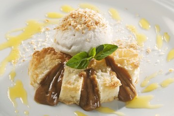 Coconut dessert with ice cream and caramel sauce
