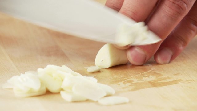 Garlic being sliced