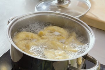 Cooking pierogi (savoury filled dumplings) in boiling water