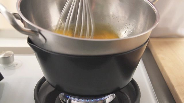 Eggs being beaten in a bain marie