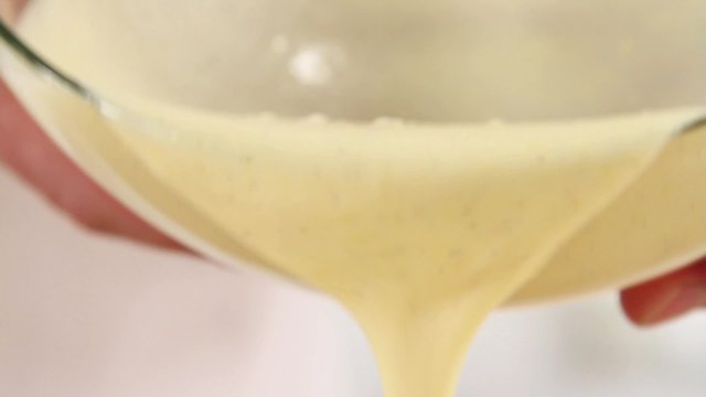 Vanilla sauce being sieved