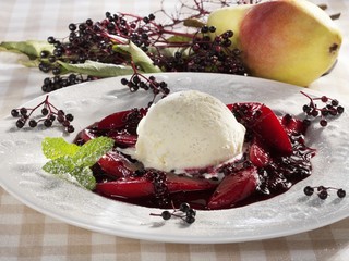 Fototapeta premium Vanilla ice cream on stewed elderberries and pears