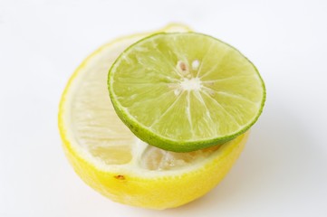 A slice of lime on half a lemon