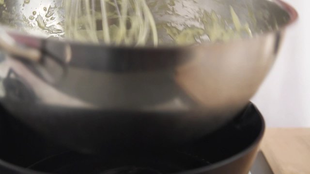 Egg cream being stirred over a bain marie