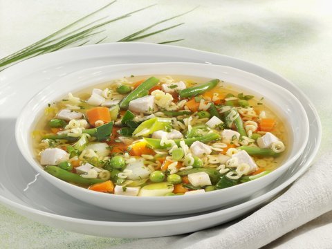 Chicken and vegetable soup with alphabet pasta