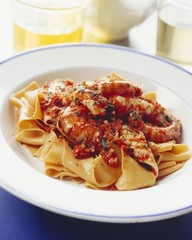 Grilled squid and prawns with chilli sauce and pasta