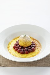 Creme brulee with raspberries and vanilla ice cream