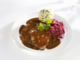 Marinated pot roast with bread dumplings and red cabbage