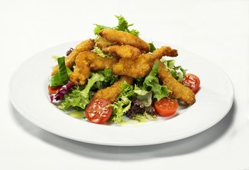 Salad leaves with breaded chicken fillets