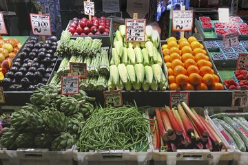 Fruit and vegetables on a market stand at the Pike Place Market, Seattle, USA