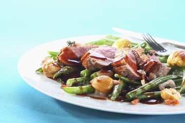 Duck breast with bacon-beans and edible chestnuts