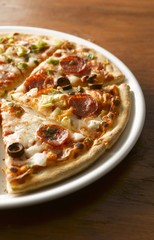 Salami pizza, sliced