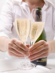 Hands holding two glasses of champagne